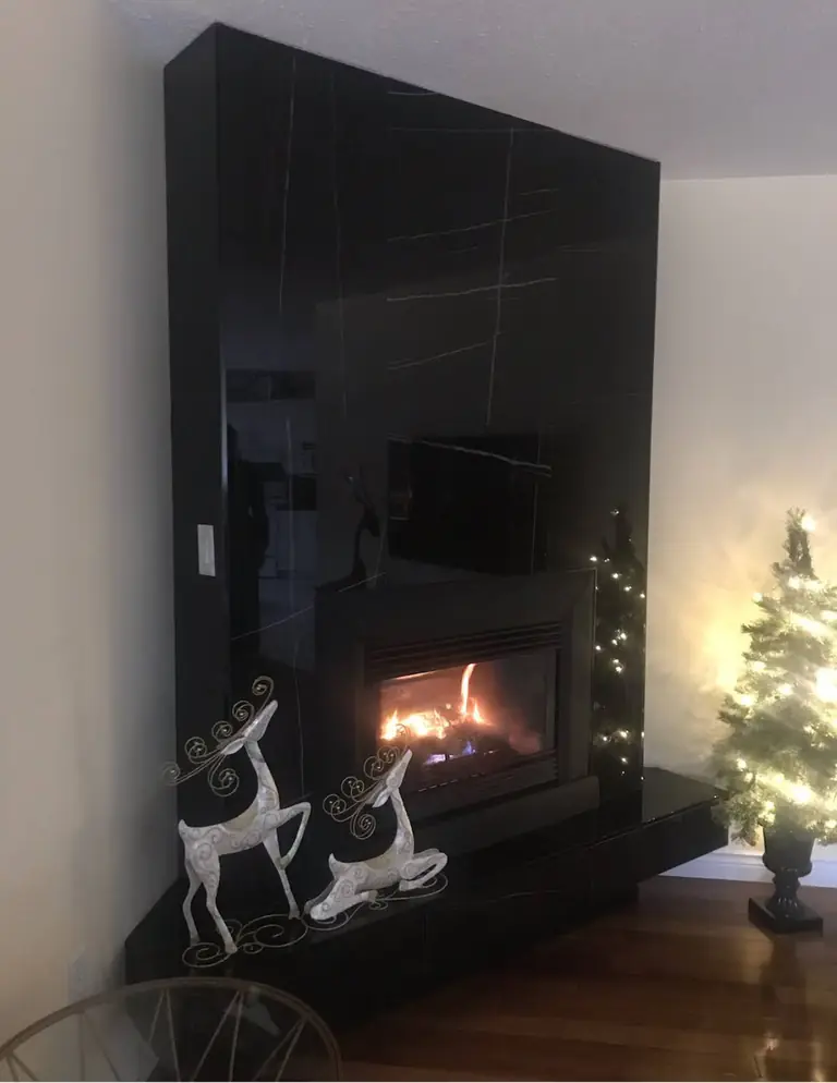 Finished black custom fireplace installation