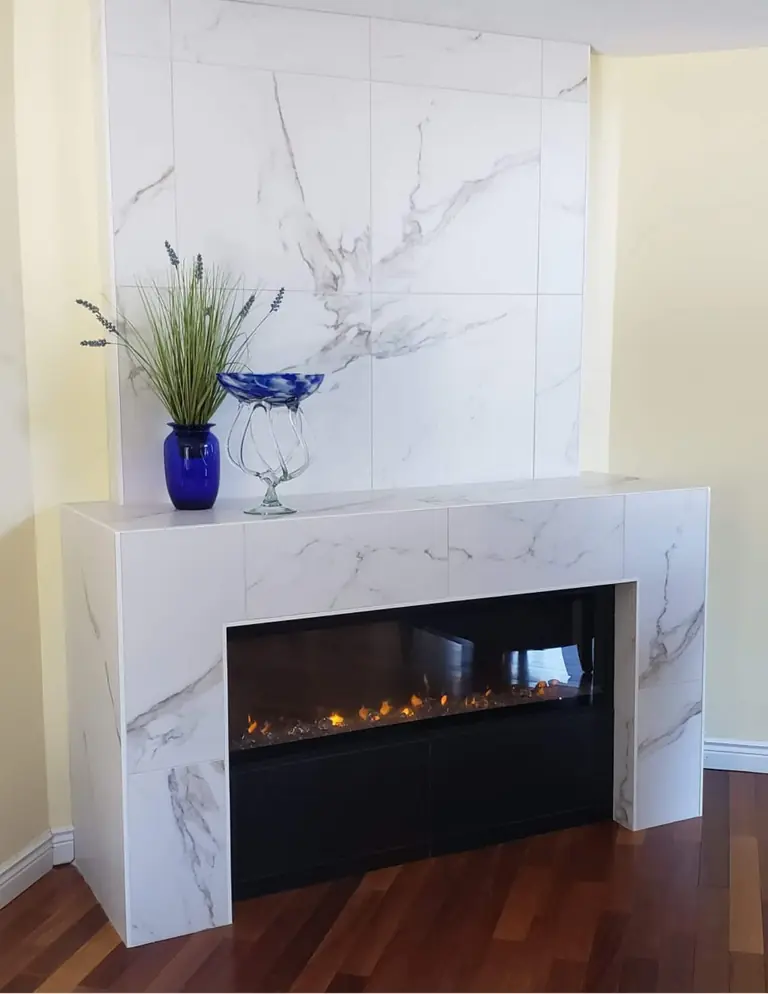 Custom fireplace finished with white stone tile