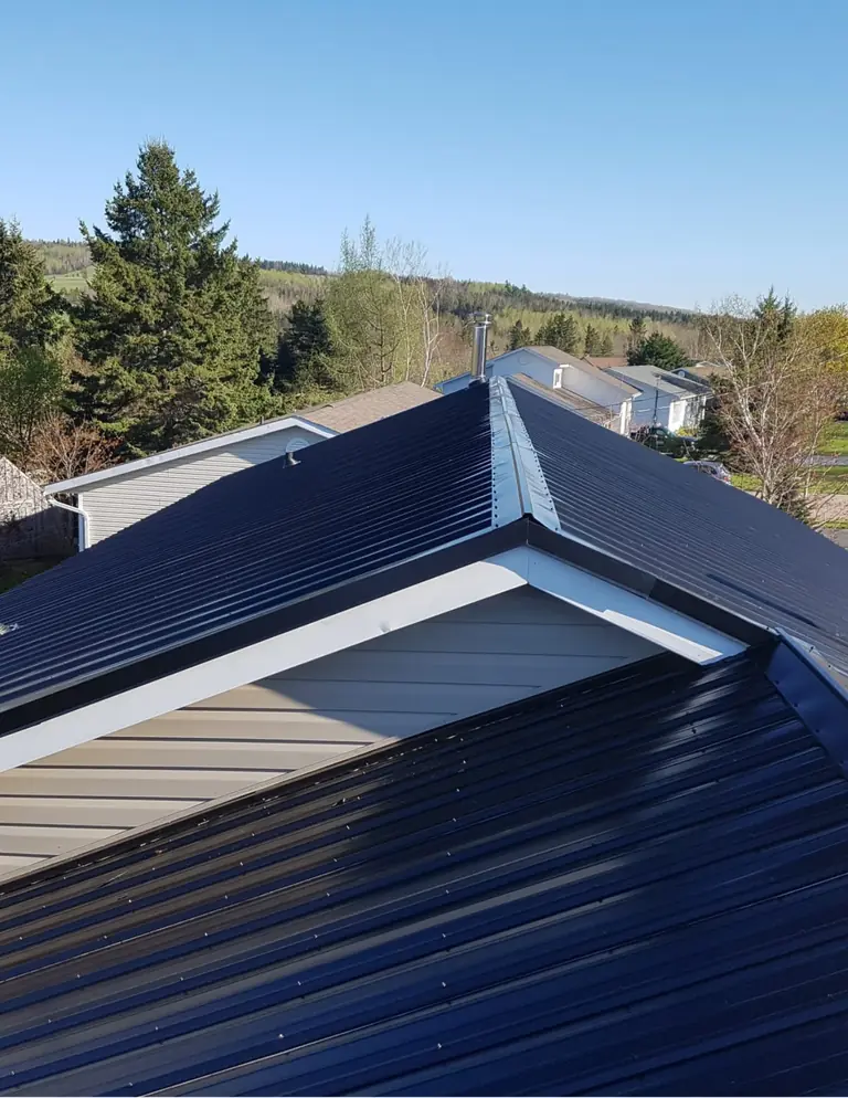 Steel roof installation on a residential building
